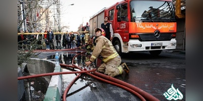 آتش سوزی ساختمان ۸ طبقه ولیعصر ادامه دارد