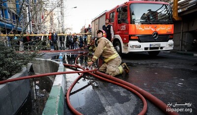 آتش سوزی ساختمان ۸ طبقه ولیعصر ادامه دارد